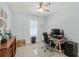 Bright home office with desk, chair, and ample natural light at 4711 S Atlantic Ave, Ponce Inlet, FL 32127