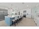 Spacious kitchen with island, stainless steel appliances, and white cabinets at 4711 S Atlantic Ave, Ponce Inlet, FL 32127