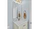 Small bathroom with vanity, mirror, and plenty of counter space at 4711 S Atlantic Ave, Ponce Inlet, FL 32127