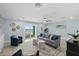 Spacious living room with ocean view, comfy seating, and built-in shelving at 4711 S Atlantic Ave, Ponce Inlet, FL 32127