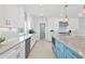 Large kitchen with island, stainless steel appliances, and white cabinets at 4711 S Atlantic Ave, Ponce Inlet, FL 32127