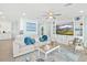 Living room with ocean view, comfy seating, and a large TV at 4711 S Atlantic Ave, Ponce Inlet, FL 32127