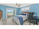 Bedroom with ocean view, king-size bed, and gaming setup at 4711 S Atlantic Ave, Ponce Inlet, FL 32127