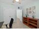 Home office with built-in shelving and double door closet at 4711 S Atlantic Ave, Ponce Inlet, FL 32127