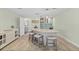 Modern wet bar with gray cabinets and a light-colored countertop at 4711 S Atlantic Ave, Ponce Inlet, FL 32127