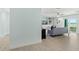 Living room with ocean view, light blue walls, and wood-look floors at 4711 S Atlantic Ave, Ponce Inlet, FL 32127