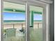 Private balcony with ocean view and comfortable seating at 4711 S Atlantic Ave, Ponce Inlet, FL 32127