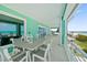 Oceanfront balcony dining area with seating for six at 4711 S Atlantic Ave, Ponce Inlet, FL 32127