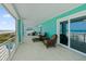 Beachfront balcony with wicker furniture offering ocean views at 4711 S Atlantic Ave, Ponce Inlet, FL 32127