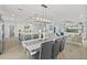 Open concept dining area with seating for six and kitchen views at 4711 S Atlantic Ave, Ponce Inlet, FL 32127