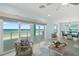 Living room with ocean view, comfortable seating, and access to balcony at 4711 S Atlantic Ave, Ponce Inlet, FL 32127