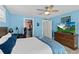 Bedroom with king-size bed, walk-in closet, and large TV at 4711 S Atlantic Ave, Ponce Inlet, FL 32127