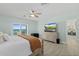 Main bedroom with ocean view, dresser, and ceiling fan at 4711 S Atlantic Ave, Ponce Inlet, FL 32127