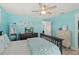 Bedroom with a double bed, dresser, and a wall-mounted TV at 4711 S Atlantic Ave, Ponce Inlet, FL 32127