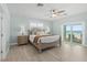 Main bedroom with ocean view, wood flooring, and ceiling fan at 4711 S Atlantic Ave, Ponce Inlet, FL 32127