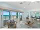 Ocean view living room with comfy seating and access to balcony at 4711 S Atlantic Ave, Ponce Inlet, FL 32127