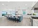 Ocean-view kitchen with island, stainless steel appliances, and white cabinetry at 4711 S Atlantic Ave, Ponce Inlet, FL 32127