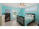 Bedroom with light teal walls, double bed, and built-in shelving at 4711 S Atlantic Ave, Ponce Inlet, FL 32127