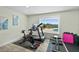 Home gym with ocean views, treadmill, exercise bike, and weights at 4711 S Atlantic Ave, Ponce Inlet, FL 32127