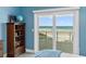 Sliding glass doors reveal a stunning ocean view from this bedroom at 4711 S Atlantic Ave, Ponce Inlet, FL 32127