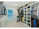 Spacious walk-in closet with ample shelving and hanging space at 4711 S Atlantic Ave, Ponce Inlet, FL 32127