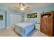 Comfortable bedroom with a striped bedspread and ample closet space at 4575 S Atlantic Ave # 6310, Port Orange, FL 32127
