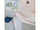 Bathroom with soaking tub, walk-in shower, and updated vanity at 4575 S Atlantic Ave # 6310, Port Orange, FL 32127