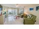 Comfortable living room with leather sofas and ocean views at 4575 S Atlantic Ave # 6310, Port Orange, FL 32127