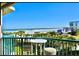 Balcony with ocean view and small table and chairs at 4575 S Atlantic Ave # 6310, Port Orange, FL 32127