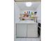 Laundry room with washer, dryer, and ample storage shelves at 4575 S Atlantic Ave # 6310, Port Orange, FL 32127