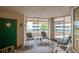 Enclosed patio with seating and large windows at 4575 S Atlantic Ave # 6310, Port Orange, FL 32127