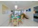 Bright dining room with table and chairs, near living room at 4575 S Atlantic Ave # 6310, Port Orange, FL 32127