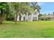 Two-story house with a gray roof and a lush lawn at 2 King Phillips Way, Ormond Beach, FL 32174