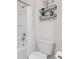 Clean bathroom with a toilet, bathtub, and shower at 225 Sunset Point Dr, Ormond Beach, FL 32174