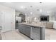 Open kitchen with island, granite counters, and stainless steel dishwasher at 225 Sunset Point Dr, Ormond Beach, FL 32174