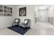 Entryway with gray stone accent wall and seating area at 225 Sunset Point Dr, Ormond Beach, FL 32174