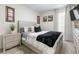 Cozy bedroom with a queen-size bed and neutral decor at 225 Sunset Point Dr, Ormond Beach, FL 32174