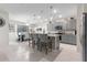 Modern kitchen with gray cabinets, granite counters, and an island at 225 Sunset Point Dr, Ormond Beach, FL 32174