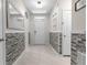 Bright entryway with gray stone wall accents at 225 Sunset Point Dr, Ormond Beach, FL 32174