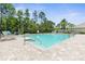 Relaxing community pool with plenty of lounge chairs at 225 Sunset Point Dr, Ormond Beach, FL 32174