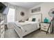 Bedroom with a white dresser, TV, and a comfortable bed at 225 Sunset Point Dr, Ormond Beach, FL 32174