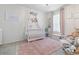 Adorable Bedroom with crib, plush rug, and decor at 225 Sunset Point Dr, Ormond Beach, FL 32174