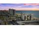 Aerial view of beachfront building at sunset at 2615 S Atlantic Ave # 7H, Daytona Beach, FL 32118