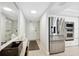 Modern kitchen with stainless steel appliances and white cabinetry at 2615 S Atlantic Ave # 7H, Daytona Beach, FL 32118