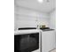 Convenient laundry room with side-by-side washer and dryer at 2615 S Atlantic Ave # 7H, Daytona Beach, FL 32118