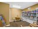Quiet library with bookshelves and comfortable seating at 2615 S Atlantic Ave # 7H, Daytona Beach, FL 32118