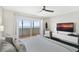 King size bed, ocean view, and private balcony access at 2615 S Atlantic Ave # 7H, Daytona Beach, FL 32118