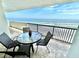 Spacious balcony with table and chairs, showcasing stunning ocean views at 2615 S Atlantic Ave # 7H, Daytona Beach, FL 32118