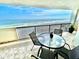 Spacious balcony with table and chairs, showcasing stunning ocean views at 2615 S Atlantic Ave # 7H, Daytona Beach, FL 32118