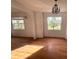 Bright dining room with hardwood floors and large windows at 820 N Oleander Ave, Daytona Beach, FL 32118